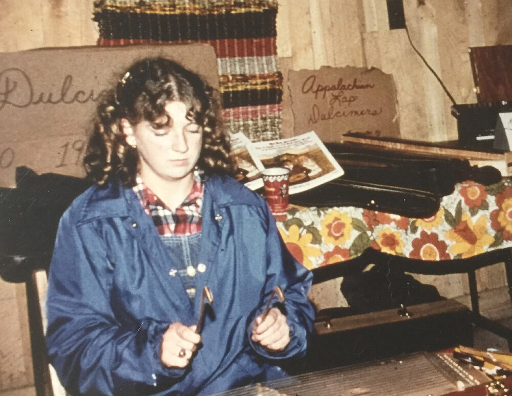 Kendra playing hammered dulcimer as a teenager